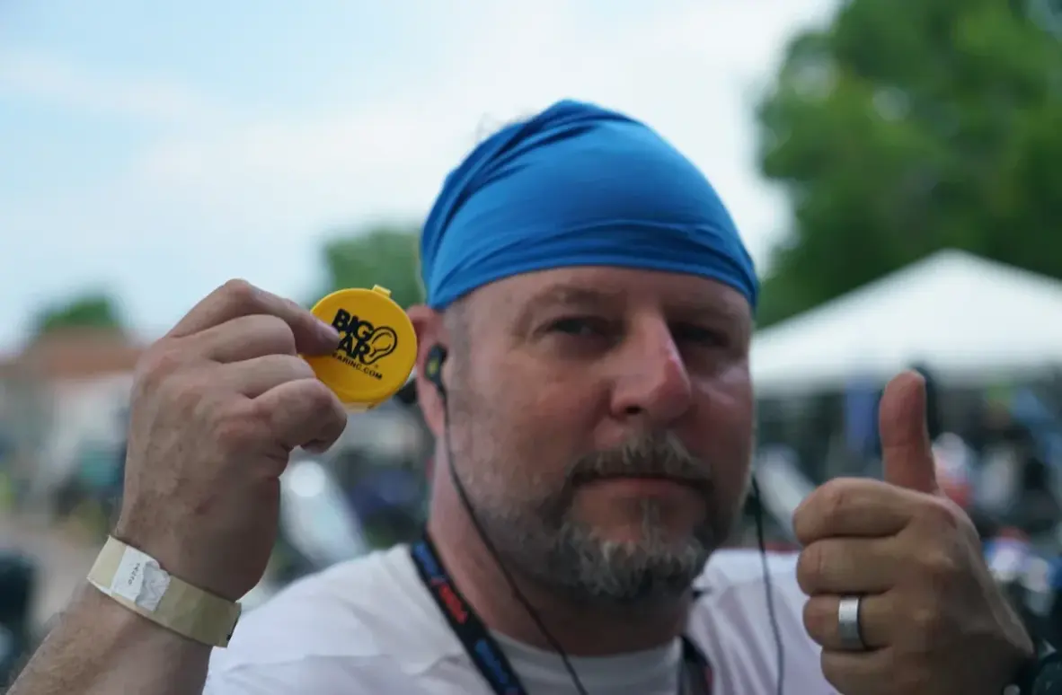 A rider giving a thumbs up with his Big Ear case
